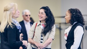 Jennifer Serino from the Lake County Workforce Development Board talks with Satori Bailey, program and impact manager for the Hunter Family Foundation, and Jessica Taylor, co-managing director - North Chicago at the Steans Family Foundation, during RFU’s Health Equity Breakfast.