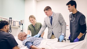 Assistant professor, Rob Aitchison, DMS, PA-C, CHSE, CAQ-EM, guides students through a simulated patient assessment in the VHS emergency room.