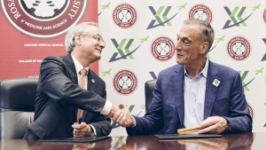 RFU President Aron Sousa, MD, and John Shufeldt, MD, JD, MBA mark a new partnership between RFU and Xcellerant Ventures with the signing of a memorandum of understanding.
