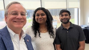 (Left to right) Aron with Charmila Meesala, MS Clinical Counseling, 2nd year, and Emaad Syed, CMS ‘28. Charmila and Emaad organized “Lost and Found” the current exhibit of the RFU Photography Club in the Scholl Gallery.