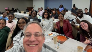 Aron with the Student National Medical Association at their Paint and Sip event. The mocktail was delicious, and the painting was fun. Turns out that Aron likes to work with his hands.