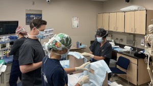 A team of medical professionals engages in research activities in a laboratory, utilizing various scientific instruments.
