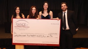 Eesha Singh CMS '29, Madeline Marks CMS '29, Scholl Class President Ahya Snyder DPM '28, and Arben Dardovski DPM '28 showcase the $60,574.94 raised at Dance for Health Equity and Educational Excellence to benefit the RFU Interprofessional Community Clinic.