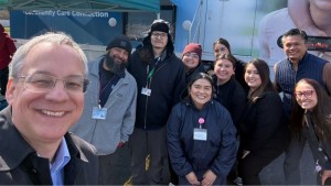 Aron with the Community Care Connection team and the mobile truck.