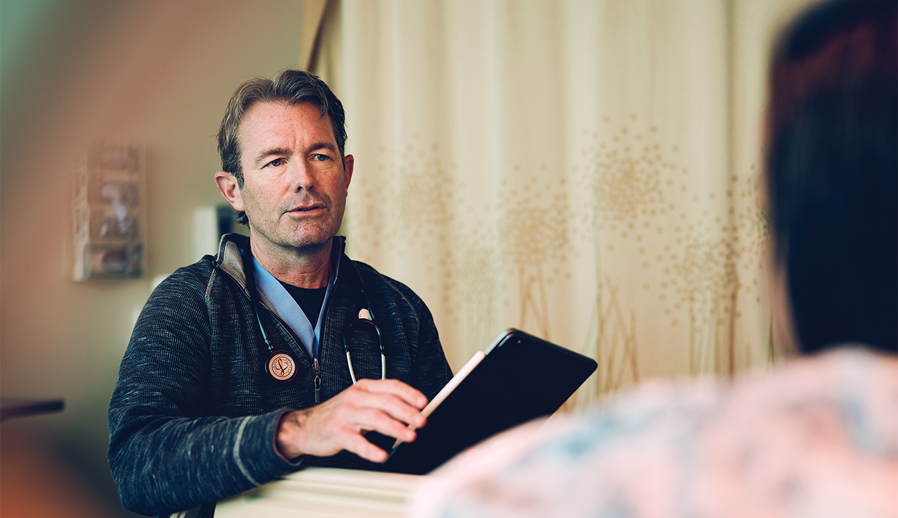 Dr. James Carlson relies on ambient scribing to capture accurate details of his visit with a patient.