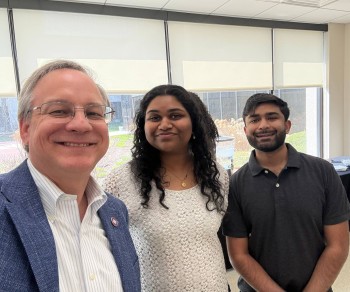 (Left to right) Aron with Charmila Meesala, MS Clinical Counseling, 2nd year, and Emaad Syed, CMS ‘28. Charmila and Emaad organized “Lost and Found” the current exhibit of the RFU Photography Club in the Scholl Gallery. 