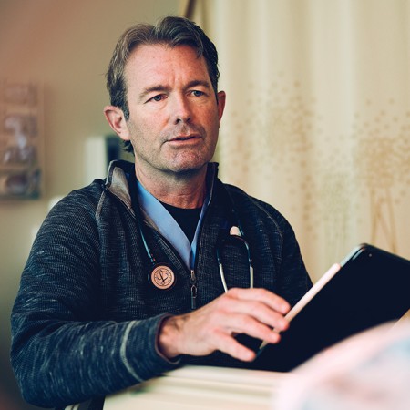Dr. James Carlson  relies on ambient  scribing to  capture accurate  details of his visit  with a patient.