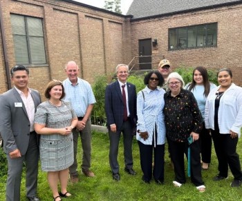Aron with the team visiting the Healing Garden. From left: Jeff Espina, Shelly Bryzcki, Bob Jackson, Aron Sousa, Senator Adriane Johnson, Jeremy Couch, Ellen Ewing, Mayra Trujillo, and Jocelyn Rodriguez. 