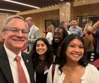 Aron with College of Pharmacy students Riya Kini ‘28, Leah Rogers ‘27, Abigail Noble ‘28