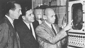 Prolific author and head of cardiovascular research Aldo Luisada, MD (at right), illustrates a piece of equipment in his laboratory during a tour of the Chicago Medical School Institute in 1963.