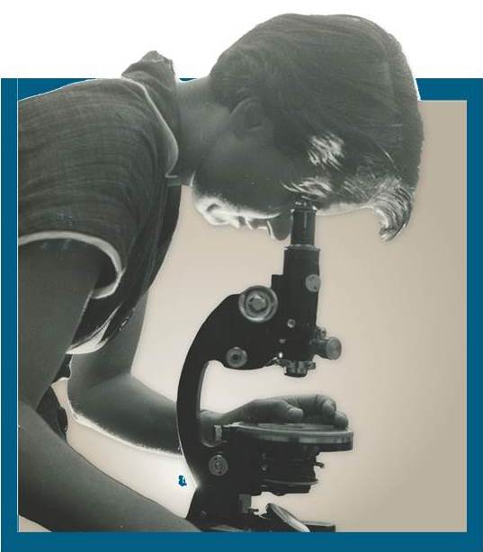 Rosalind Franklin at a Microscope