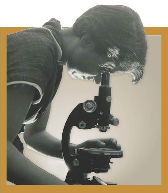 Rosalind Franklin at a Microscope